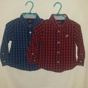 Two nice button down long sleeved shirts.